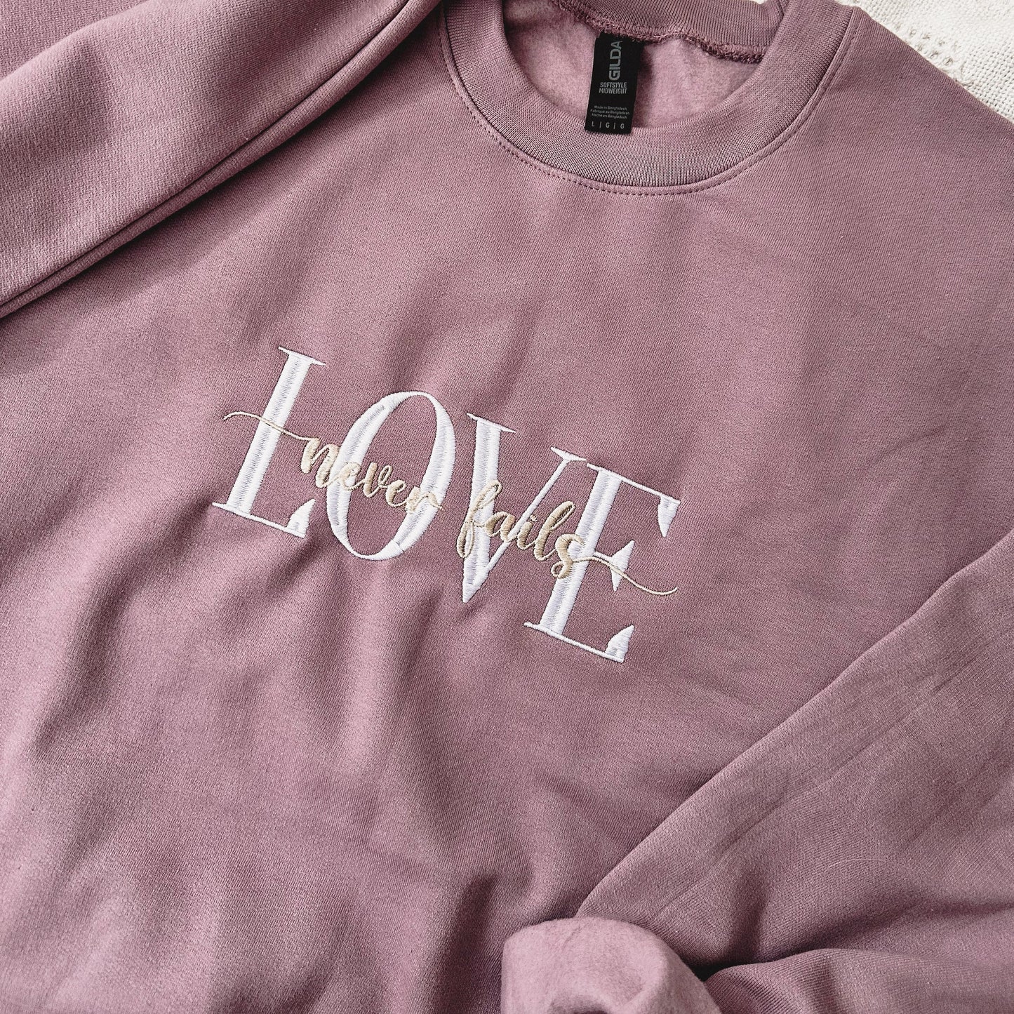 Love Never Fails Crewneck